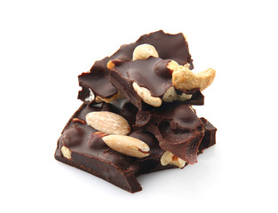 Tasty dark chocolate with nuts on white background