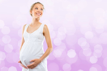 Portrait of the young happy smiling pregnant woman