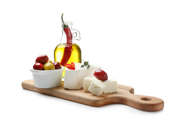 Board with tasty feta cheese and olive oil on white background