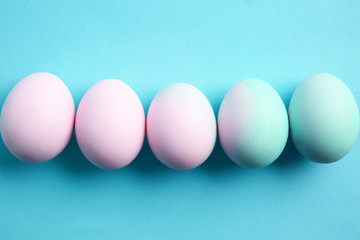 Beautiful Easter eggs on color background