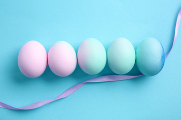 Beautiful Easter eggs on color background