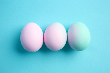 Beautiful Easter eggs on color background