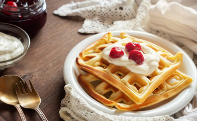 Waffles with sour cream and cherry jam