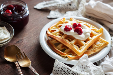 Waffles with sour cream and cherry jam