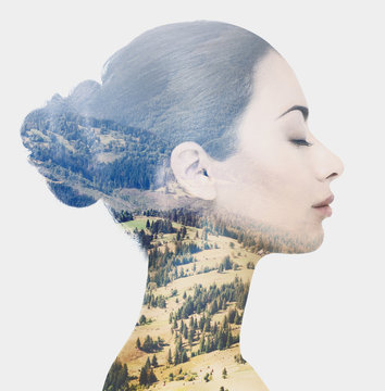 Double Exposure Of Female Face And Rocky Landscape