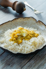 Haddock in creamed coconut and corn curry with rice