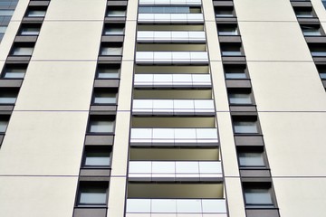 Multistory new modern apartment building. Stylish living block of flats.