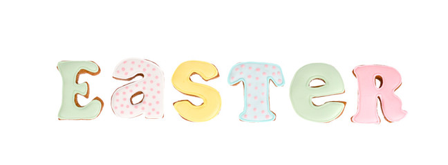 Homemade pastry biscuit letters for EASTER lettering, isolated on white background.