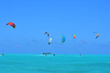 People practicing kitesurfing on a beautiful summer day - Caribbean - Archipelago of Los Roques - Venezuela