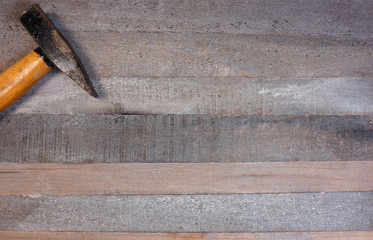 Hammers on a wooden board background