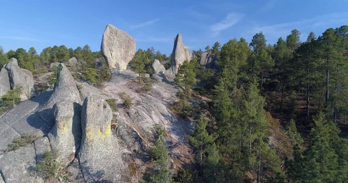 Aerial shot of a Madrone tree and rock formations in El Valle de loss Monies, Copper Canyon Region, Chihuahua.