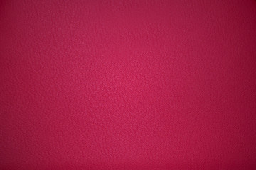 Pink fabric texture with vignetting