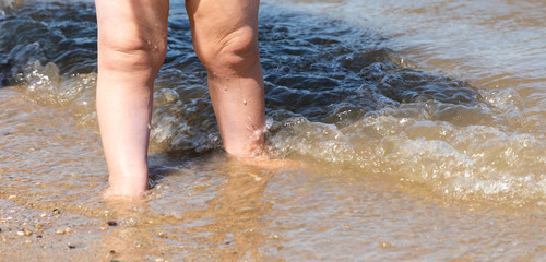 baby feet at beach north sea
