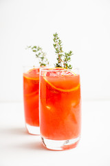 Bloody oranges beverage with thyme. Selective focus. Shallow depth of field.