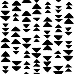 Obraz premium Hand drawn black and white background with triangles. Seamless vector pattern