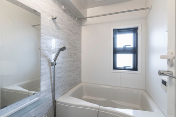 White bath tub in modern small bathroom