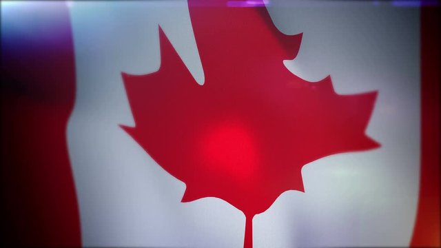 Wonderful slow motion 3d rendering of a large Canadian flag with a maple leaf in the center of it fluttering in slow motion in the black background. It looks patriotic, impressive and festive.. 