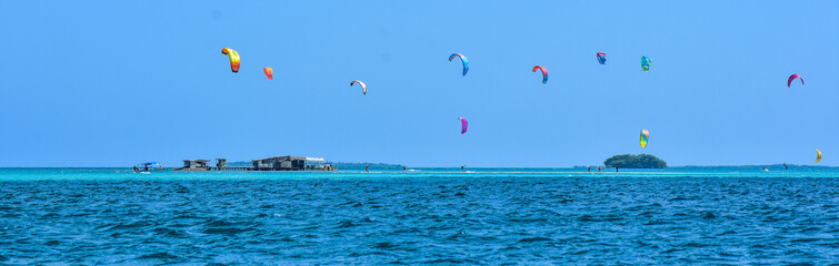 People practicing kitesurfing on a beautiful summer day - Caribbean - Archipelago of Los Roques - Venezuela