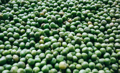 Fresh green peas background. Vegetarian healthy food texture. Vegetables low fat diet.