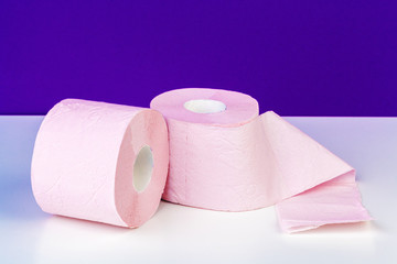 Roll of toilet paper or tissue  on color background
