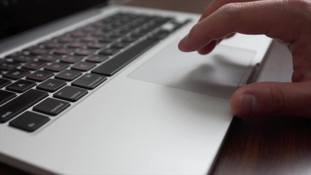 Close up of using mouse on laptop