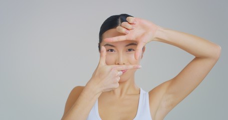 Portrait of asian woman with beautiful face with perfect skin just cleaned from impurities ready for day or night cream is looking in camera. 