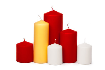 different size and colors candles isolated on a white background