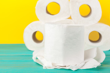 Toilet paper stacks  on bright yellow background