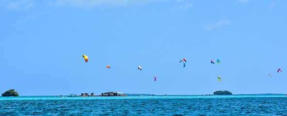People practicing kitesurfing on a beautiful summer day - Caribbean - Archipelago of Los Roques - Venezuela