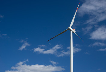 wind turbine against blue sky