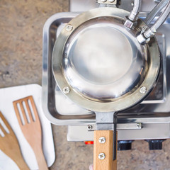 Fototapeta premium Waffle maker for making Hong Kong waffles in the kitchen of restauran. Top view, flat lay