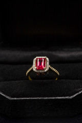 red ruby ring on black boks