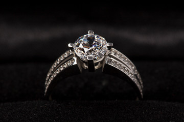 wedding diamond ring on black background