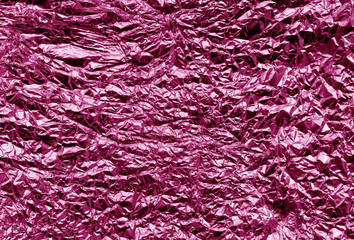 Metal foil texture in pink color.
