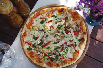 Top view of a vegetarian pizza with mushroom and vegetablebles