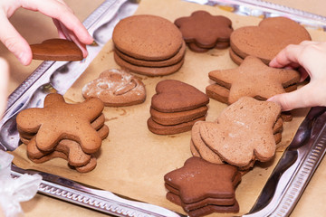 Children's hands reach for freshly baked liver. Celebration of the holiday and the concept of cooking.