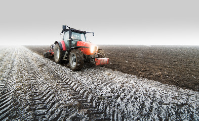Tractor plowing a field