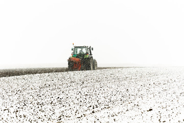 Tractor plowing a field