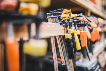 Carpentry workshop - a professional tool in the workplace- clamps