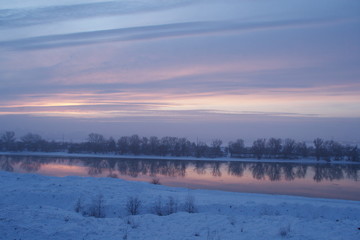 Winter River at sunset and the forest