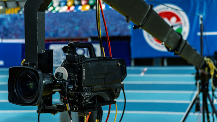 A television camera on a crane outside the studio. The video camera hanging on the crane prepares...