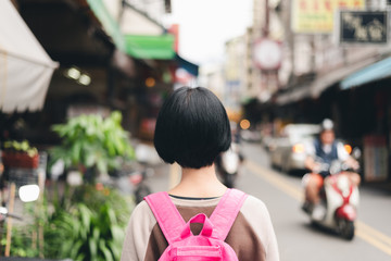 traveling woman in the traditional marketplace