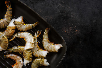 Raw tiger king shrimps on pan