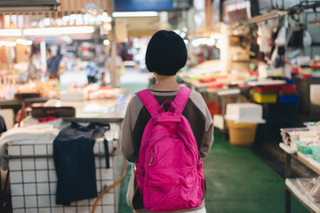 traveling woman in the traditional marketplace