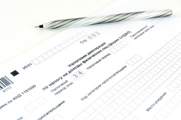 Russian documents. 3-NDFL tax return form and pen