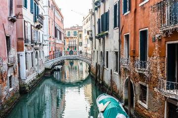 Naklejka na ściany i meble Docked boats on a canal in Venice