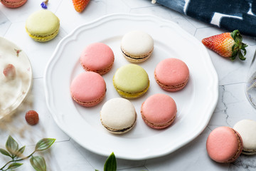 Macaron or French macaroon cookies dessert. Set on cafe table.