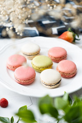 Macaron or French macaroon cookies dessert. Set on cafe table.