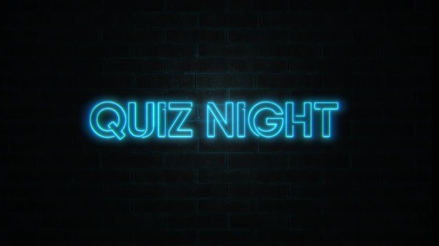 Quiz night logo neon lights on brick wall