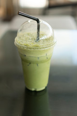 Green tea placed on a black table